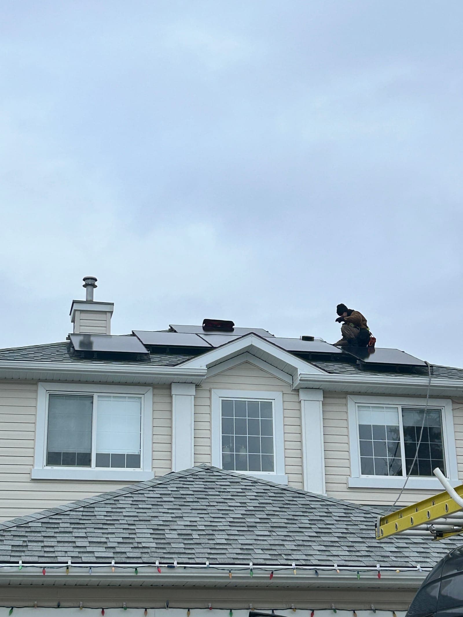 Flux Renewables crew installing donated solar panels on a Calgary home for the United Way campaign