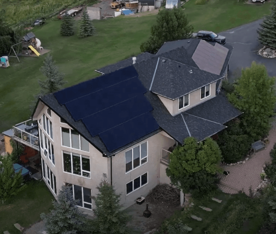 Aerial view of the award-winning Misty Ridge residential solar installation by Flux Renewables in the Alberta foothills